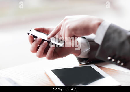 close up.businessman presses his finger on the screen of the sma Stock Photo