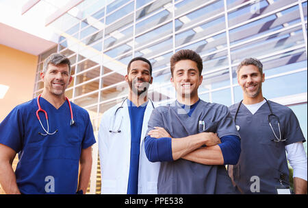 Male healthcare colleagues standing outdoors, low angle Stock Photo