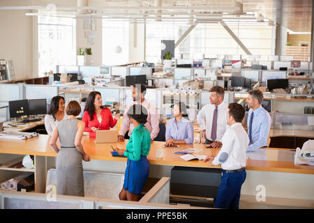 Business team meeting in an open plan office, elevated view Stock Photo