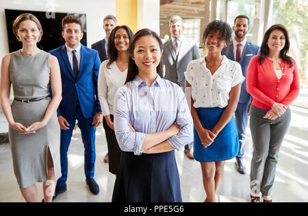 Asian businesswoman and her business team, group portrait Stock Photo