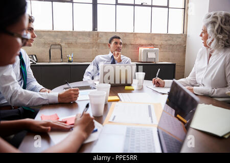 Business team brainstorming in a meeting room Stock Photo