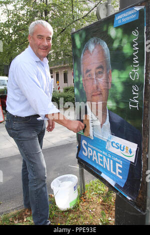 Campaign for the 2013 Bavarian state election: the Bavarian Minister of Culture Ludwig Spaenle (CSU) puts up posters of himself. Stock Photo