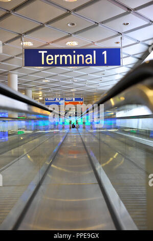 A moving walkway in Terminal 1 at Munich Airport. Stock Photo