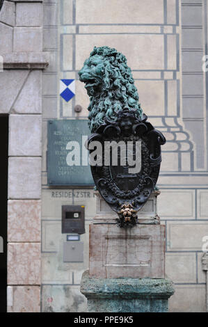 Bronze lion by Hubert Gerard in the Residenzstrasse in front of the Munich Residenz. Stock Photo