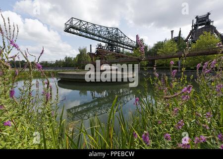 Transformation of a former ironworks and an industrial fallow to the Landscape Park Duisburg-Nord, a public park and an industrial monument, two former furnace | usage worldwide Stock Photo