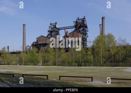 Transformation of a former ironworks and an industrial fallow to the Landscape Park Duisburg-Nord, a public park and an industrial monument, two former furnace | usage worldwide Stock Photo