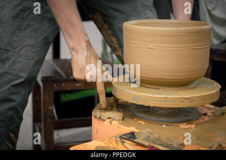 Caucasian man working on a potter's wheel Stock Photo
