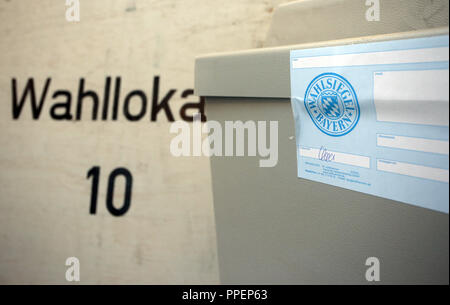 Election officials count votes during the 2014 municipal election in the polling station 10 at Josefstift (VHS) in Fuerstenfeldbruck. The picture shows a sealed ballot box. Stock Photo