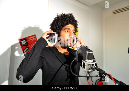 The Brazilian professional football player Dante from Bayern Munich advertises in a broadcast of Radio egoFM the concert project 'Music for Goals', which turns against racism, xenophobia and violence in society. Stock Photo