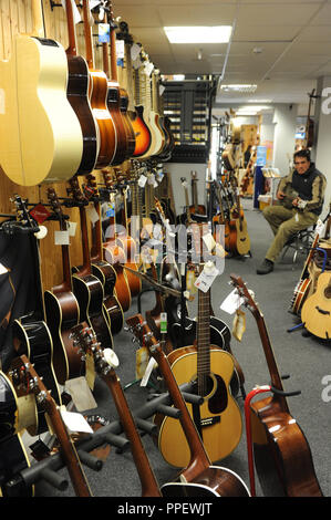 Acoustic guitars in the music store "Hieber-Lindberg" in the Sonnenstrasse in Munich. Stock Photo