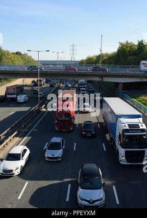 M60 motorway Whitefield interchange at junction 17 heavy traffic driving under A56 road bridge in greater manchester uk Stock Photo