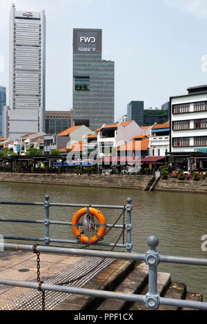 Beautiful Boat Quay with Bars and Restaurants with Singtel and FWD Insurance Skyscrapers and The Singapore River Singapore Asia Stock Photo