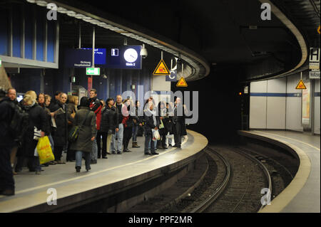 Passengers waiting at the S-bahn station Karlsplatz, Munich, Germany Stock Photo