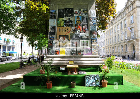 A Space Called Public - art in public space: the British artist David Shrigley has transformed the monument to the Elector Maximilian II Emmanuel in front of Hotel Bayerischer Hof on Promenadeplatz to a shrine to Michael Jackson's favorite monkey 'Bubbles'. With the action he ironically refers to the impromptu Michael Jackson memorial at the monument of Orlando di Lasso in the immediate vicinity. The art action is however becoming more and more a nuisance, since it is neglected and no one looks after it. Stock Photo