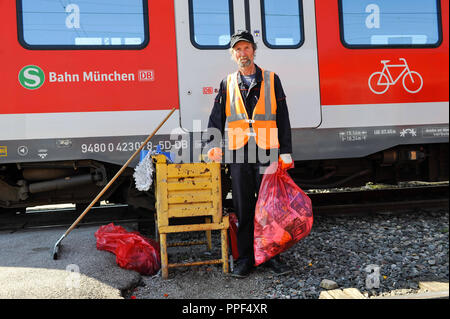 The cleaning personnel of Deutsche Bahn doing the daily cleaning of S-Bahn trains. The picture shows a garbage bag full of collected waste. Stock Photo