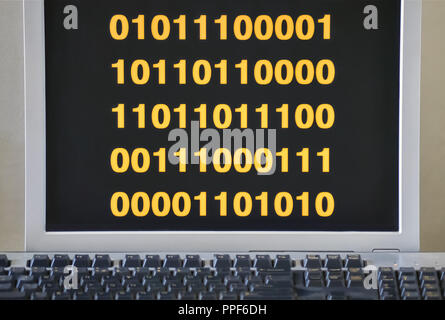 Stream of binary digits on the screen during the program execution Stock Photo