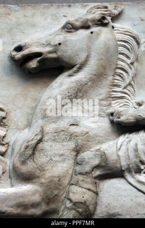 Greek Art. Parthenon. 5th century B.C. Marshal looking towards the horseman who overtakes him on the left. Detail. Horse. West Frieze I. It comes from the Acropolis in Athens. British Museum. London. England. UK. Stock Photo