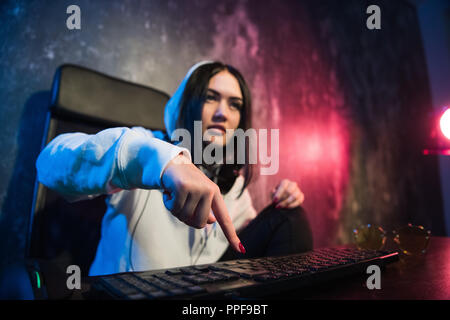 Woman hacker is ready to run malware program virus on the internet. Start hacking remote system computer Stock Photo