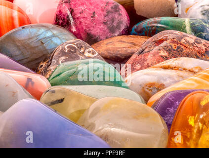 Close-up colorful semi-precious gemstones background. Beautiful natural stones background. Healing stones,horoscope stones or natural stones concept. Stock Photo