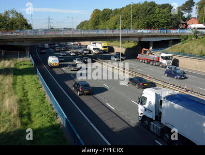 M60 motorway Whitefield interchange at junction 17 traffic driving under A56 road bridge in greater manchester uk Stock Photo