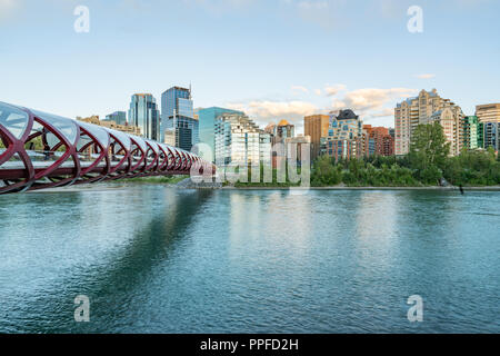 Skyline of the city Calgary, Alberta, Canada along the Bow River with Peace Bridge Stock Photo