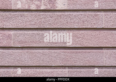 Granite block wall background on building facade Stock Photo