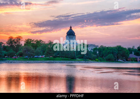 PIERRE, SD - JULY 9, 2018: South Dakota Capital Building along Capitol Lake in Pierre, SD at sunset Stock Photo