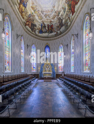 Chapel surrounded by stained glass windows in the Basilica of the Sacred Heart on the campus of the University of Notre Dame in South Bend, Indiana Stock Photo