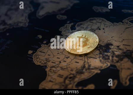 Digital currency concept - Crypto Bitcoin currency bitcoin on map Stock Photo