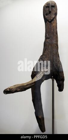 Prehistoric. Art. Metal Age. Male figure of oak, from Broddenbjerg Bog, central Jutland. Sacrifices of pots must have taken place around the wooden figure, whose simple form exhitits distinctive power and strength. In such a figure divine powers could dwell. C. 600 BC. National Museum of Denmark. Stock Photo