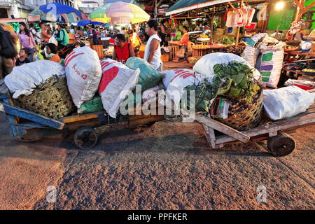 Cebu, Philippines-October 18, 2016: Porters take a break while carrying vegetables on carts. Carbon Market-oldest and largest farmer's market in town- Stock Photo