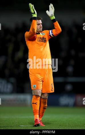 Burnley goalkeeper Thomas Heaton celebrates after team mate Kevin Long (not in frame) scores their sides first goal of the game during the third round Carabao Cup match at the Pirelli Stadium, Burton. Stock Photo