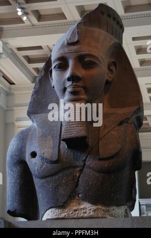 Colossal statue of Ramesses II, the Younger Memnon. C. 1250 BC. 19th Dynasty. New Kingdom. From the Ramesseum (Thebes, Egypt). Granite. Detail. British Museum. London. United Kingdom. Stock Photo