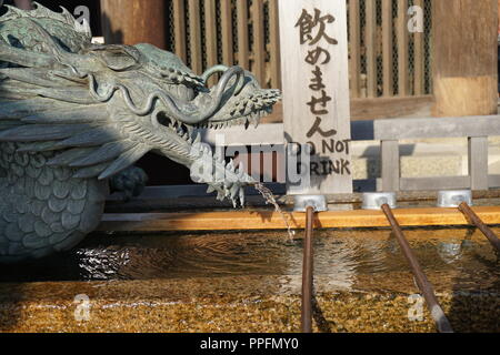 Kyoto, Japan - August 01, 2018: the water fountain for hand washing at the Kiyomizu-dera buddhist temple, a UNESCO World Cultural Heritage site.  Phot