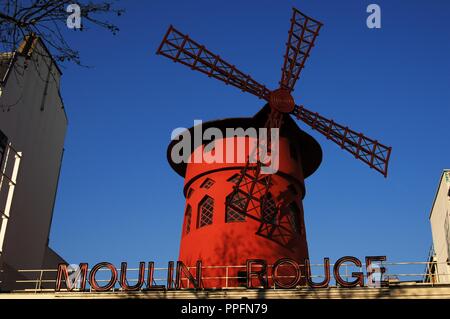 France. Paris. Moulin Rouge. Cabaret, opened in 1889. Built by Adolphe Leon Willette (1857-1926) and Edouard-Jean Niermans (1859-1928). Marked by the red windmill on its roof. Detail. Exterior. Pigalle district.