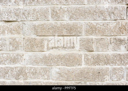 aged weathered block wall. old brick background. Stock Photo
