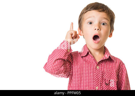 young adorable boy surprised with finger pointing upwards, isolated on white background Stock Photo