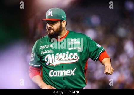 Edgar Gonzalez, starting pitcher of the Tomateros of Culiacan de Mexico, makes pitches in the first inning of the Caribbean Series baseball game again Stock Photo