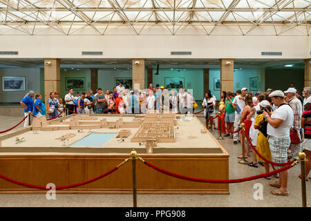 Tourists guided tour looking at temple complex model in Karnak Temple Visitor Centre in Luxor. Egypt Stock Photo