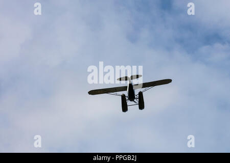 Seaplane or Floatplane flying in sky overhead Stock Photo