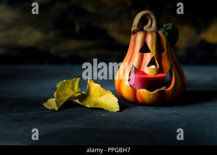 jack o lantern candle on black wooden background Stock Photo