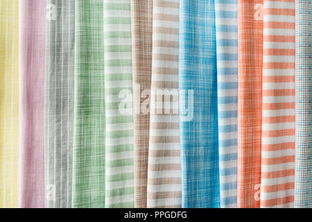Samples of fabric - flax of different colors on the display case Stock Photo
