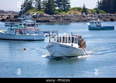 Lobster fishermen in their boats on the island of Vinalhaven, Maine. The island community in Penobscot Bay is one of the largest lobster fisheries in Stock Photo