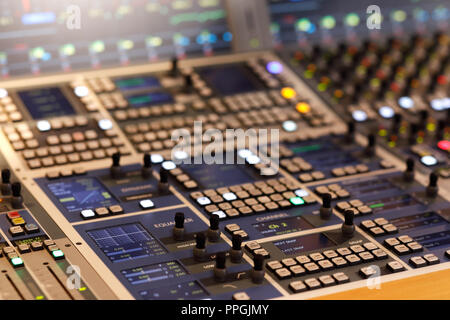 Control surface of modern audio production console. Stock Photo