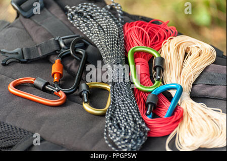 Metal carabine for mountaineering. Photo of colored carabines. Climbing concept Stock Photo