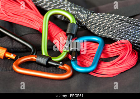 Metal carabine for mountaineering. Photo of colored carabines. Climbing concept Stock Photo