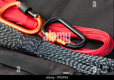 Metal carabine for mountaineering. Photo of colored carabines. Climbing concept Stock Photo