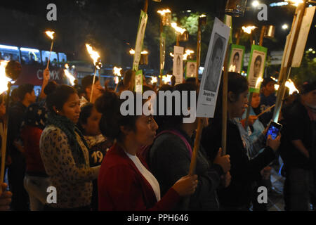 Mexico City, Mexico. 25th Sep, 2018. People seen protesting holding torches during a march demanding justice for the 43 missing students of the Normal School in the State of Guerrero, on September 26 Commemorates 4 years of the forced disappearance of students at Reforma Avenue in Mexico City. Credit: Carlos Tischler/SOPA Images/ZUMA Wire/Alamy Live News Stock Photo
