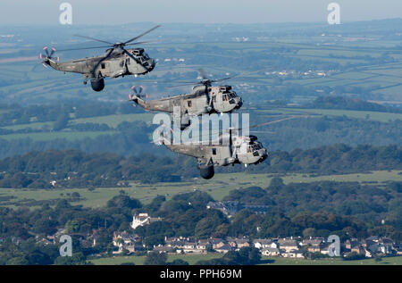 Yelverton, UK. 26th Sep 2018. FINAL FLIGHT OF THE ROYAL NAVY Sea King  Sea King Mk7 helicopters left RNAS Culdrose for the last time on Wednesday 26th September 2018   Aircraft in the pictures are flying over  over Burrator Reservoir,Sheepstor, nr Yelverton, Devon on route from RNAS Culdrose to HMS Sultan   After almost 50 years of active operations, the last military Sea King helicopters from flying in the United Kingdom, left Royal Naval Air Station Culdrose in Helston, Cornwall for retirement on Wednesday 26th September 2018.    Credit: Bob Sharples/Alamy Live News Stock Photo