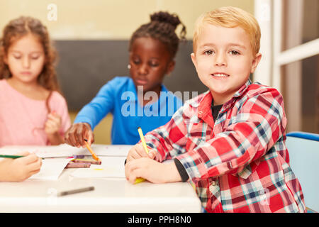 Small students children painting in art school class Stock Photo - Alamy
